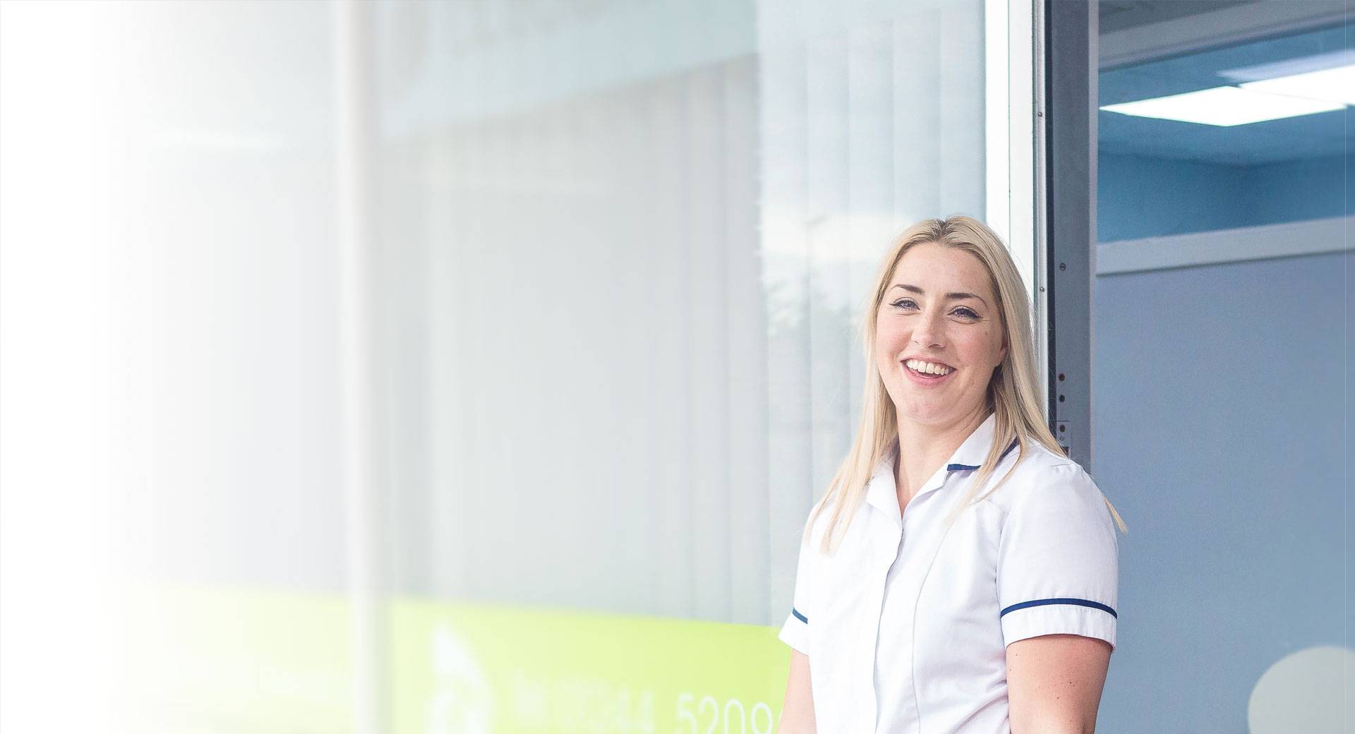 Photo of a chiropodist outside their clinic in north Wales